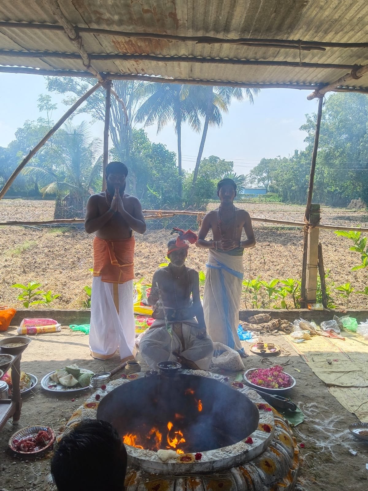 Yagna performed under a shed beside farmland